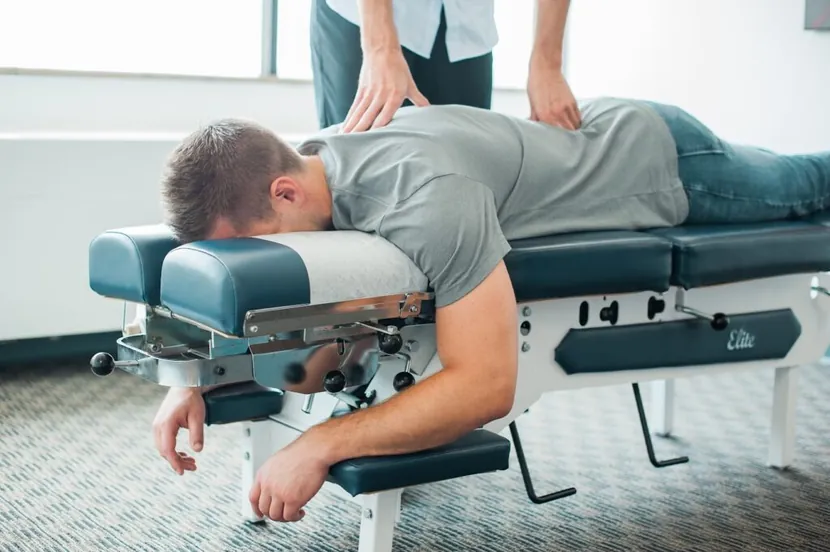 Patient lying down getting a chiropractic adjustment in Wauwatosa.