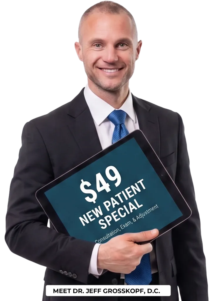Dr. Jeff holding a new patient special coupon.